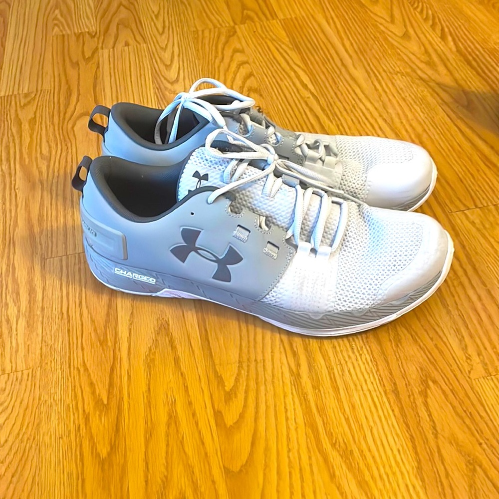 White and dark gray under armor, athletic shoes.